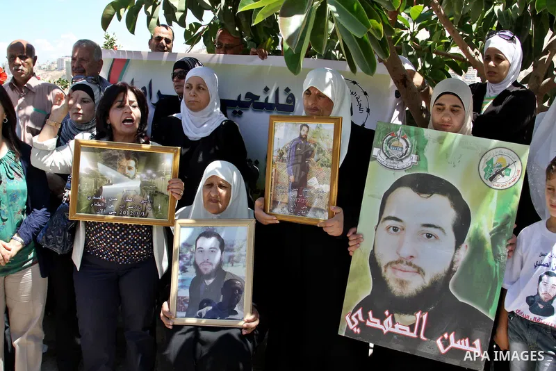 Palestinians gather during a protest in front of the Red Cross' offices in West Bank city of Nablus calling of release of palestinian prisoners on July, 04, 2012. Photo by Nedal Eshtayah