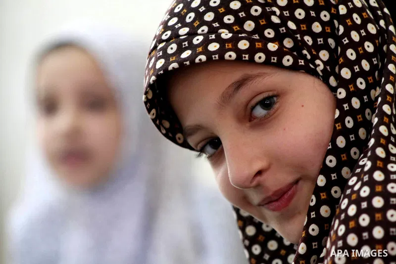 Palestinian girls read the Koran at a summer camp in the Gaza Strip, 04 July 2012. About 20,000 students, both male and female, study under the tuition of 1,200 teachers at the camp. Hamas usually isolates boys and girls...