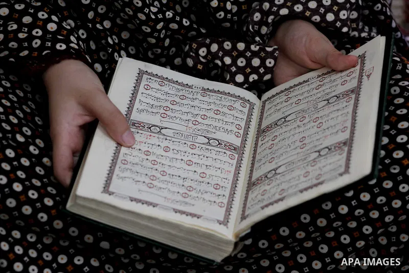 Palestinian girls read the Koran at a summer camp in the Gaza Strip, 04 July 2012. About 20,000 students, both male and female, study under the tuition of 1,200 teachers at the camp. Hamas usually isolates boys and girls...