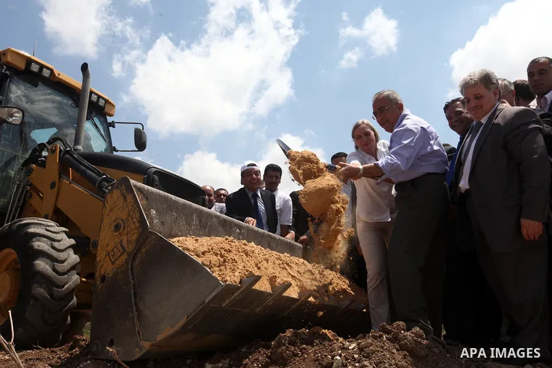 Palestinian Prime Minister Salam Fayyad puts the foundation stone of sanitation regional project in Wad al-Zumar in the West Bank city of Tulkarm on 05 July 2012. Photo by Mustafa Abu Dayeh
