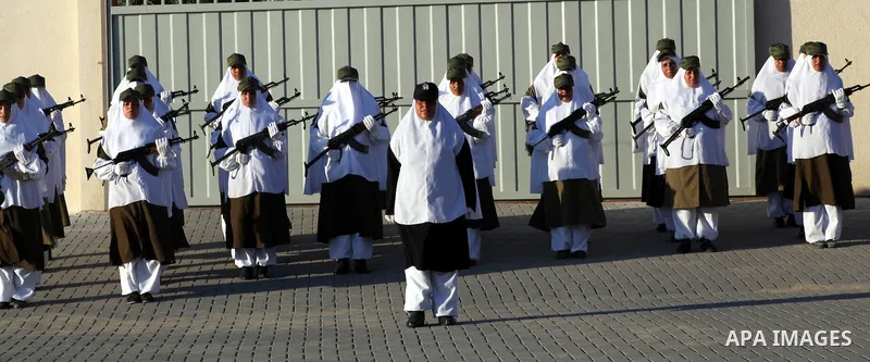 Female Hamas's police officers stand to attention during a ceremony in Gaza City on July 05, 2012. Hamas has governed the Gaza Strip since June 2007, after it won a majority of seats in the Palestinian Parliament in the...
