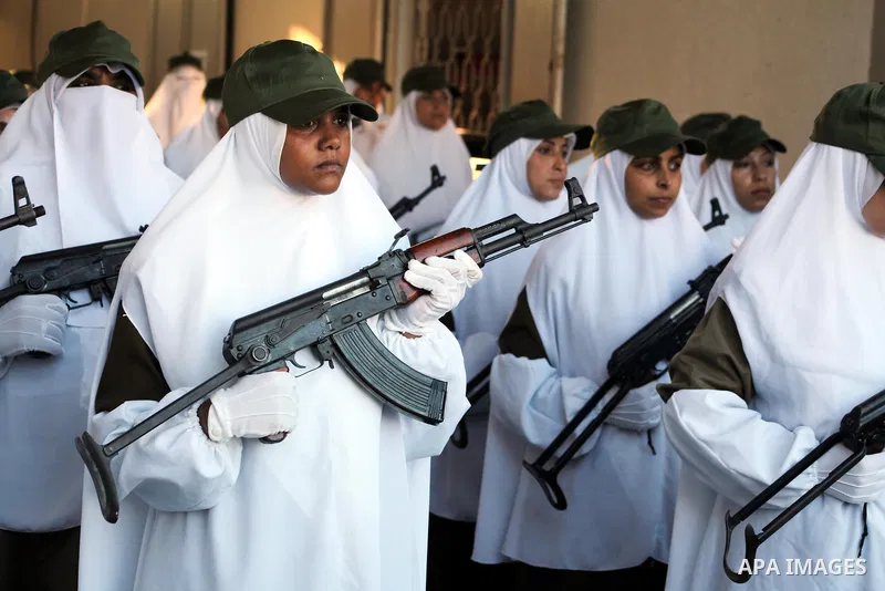 Female Hamas's police officers stand to attention during a ceremony in Gaza City on July 05, 2012. Hamas has governed the Gaza Strip since June 2007, after it won a majority of seats in the Palestinian Parliament in the...