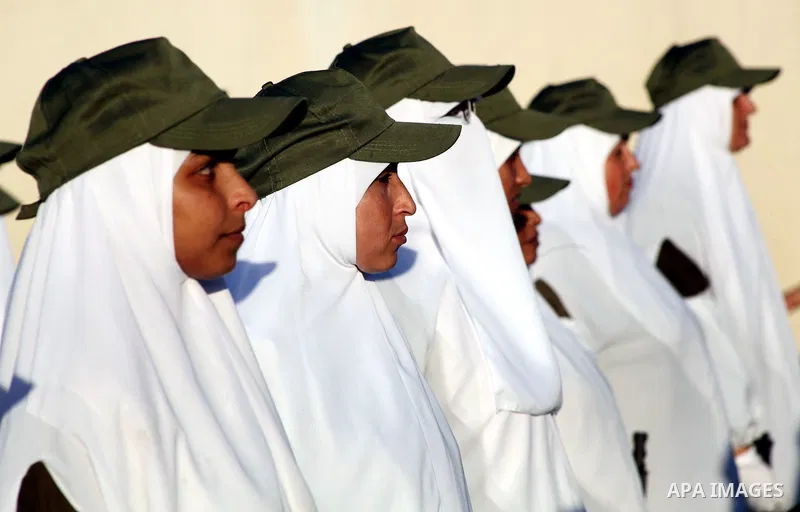 Female Hamas's police officers stand to attention during a ceremony in Gaza City on July 05, 2012. Hamas has governed the Gaza Strip since June 2007, after it won a majority of seats in the Palestinian Parliament in the...