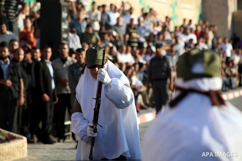 A female Hamas's police officer practices a weapon during a ceremony in Gaza City on July 05, 2012. Hamas has governed the Gaza Strip since June 2007, after it won a majority of seats in the Palestinian Parliament in the...