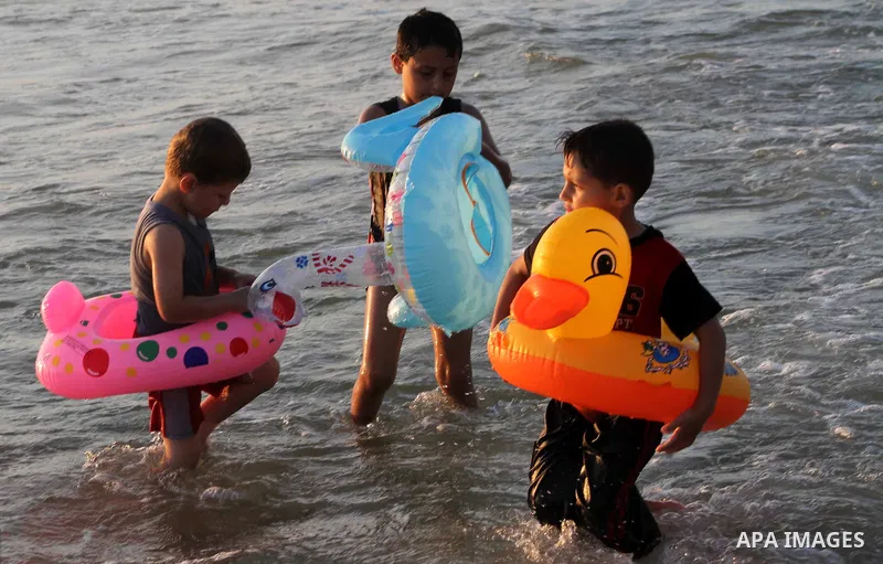 Palestinian children enjoy swimming on their week-end in the Mediterranean sea in Gaza City on July 06, 2012. Photo by Ashraf Amra