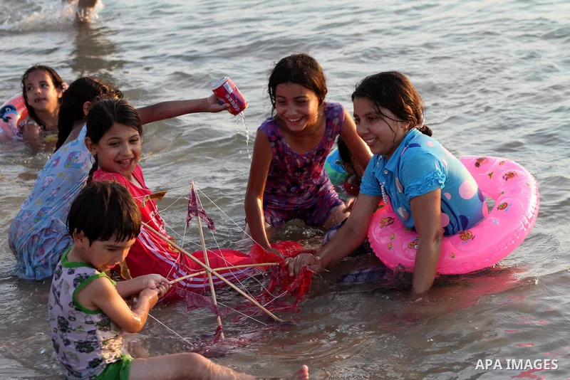 Palestinian children enjoy swimming on their week-end in the Mediterranean sea in Gaza City on July 06, 2012. Photo by Ashraf Amra