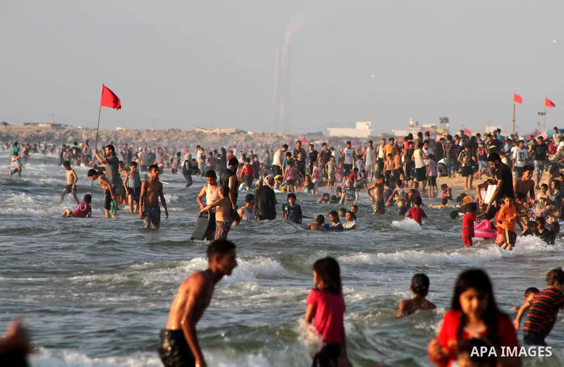 Palestinians enjoy swimming on their week-end in the Mediterranean sea in Gaza City on July 06, 2012. Photo by Ashraf Amra