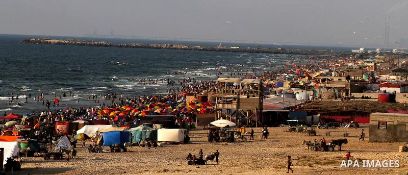 A general view for the beach on their week-end in the Mediterranean port of Gaza on July 06, 2012. Photo by Ashraf Amra