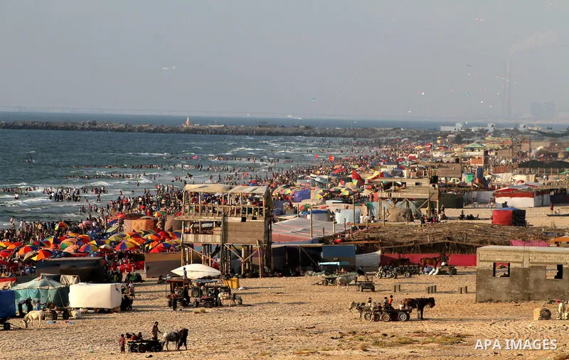 A general view for the beach on their week-end in the Mediterranean port of Gaza on July 06, 2012. Photo by Ashraf Amra