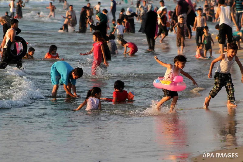 Palestinians enjoy swimming on their week-end in the Mediterranean sea in Gaza City on July 06, 2012. Photo by Ashraf Amra