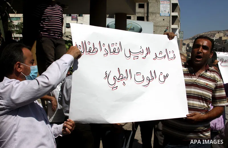Palestinian demonstrators to calling of the justice and equality and the fight against corrupt during a march in the West Bank city of Nablus in, on July 07.07 2012. Photo by Nedal Eshtayah