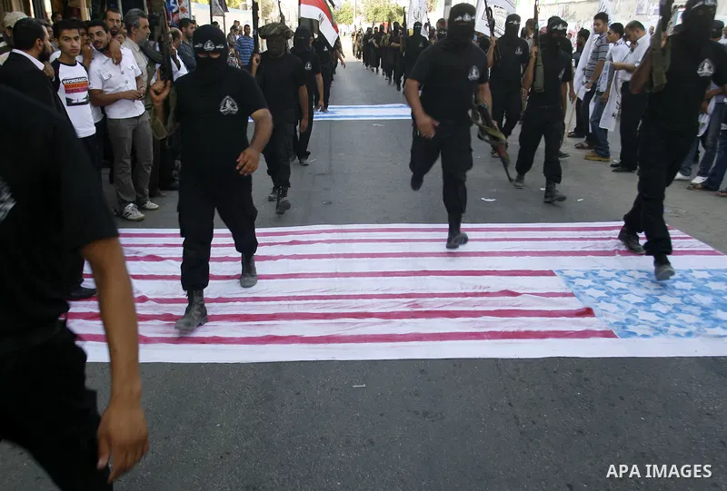 Militants from the Palestinian al-Ahrar Brigade march during a ceremony for the fifth anniversary of their inception in the southern Gaza Strip town of Rafah on July 7, 2012.. Photo by Eyad Al Baba.