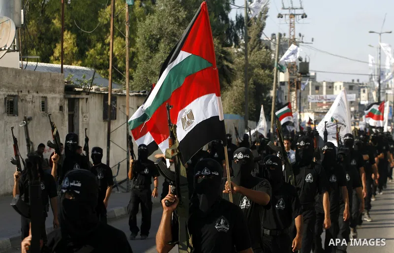Militants from the Palestinian al-Ahrar Brigade march during a ceremony for the fifth anniversary of their inception in the southern Gaza Strip town of Rafah on July 7, 2012.. Photo by Eyad Al Baba.
