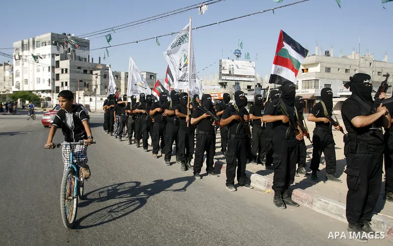 Militants from the Palestinian al-Ahrar Brigade march during a ceremony for the fifth anniversary of their inception in the southern Gaza Strip town of Rafah on July 7, 2012.. Photo by Eyad Al Baba. Photo by Eyad Al Baba