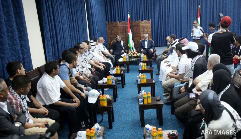 Palestinian Prime Minister in Gaza Ismail Haniyeh meets with the members of "Miles of Smiles 14" aid convoy in his office in Gaza City, on July 08 2012. Photo by Ashraf Amra