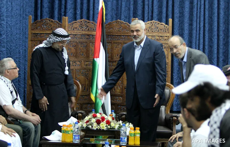Palestinian Prime Minister in Gaza Ismail Haniyeh meets with the members of "Miles of Smiles 14" aid convoy in his office in Gaza City, on July 08 2012. Photo by Ashraf Amra
