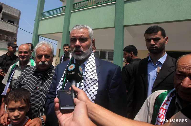 Palestinian Prime Minister in Gaza Ismail Haniyeh speaks during the opening of a new school in Zaytoon neighborhood Gaza city on 08 July 2012. A Palestinian official says Gaza's prime minister will head to Cairo within t...