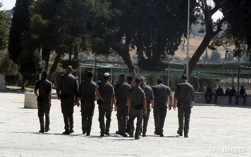 Israeli soldiers walk past the Al-Aqsa mosque compound, Islam's third holiest site, during a visit under Israeli police protection in Jerusalem's Old City on July 08, 2012. Photo by Mahfouz Abu Turk