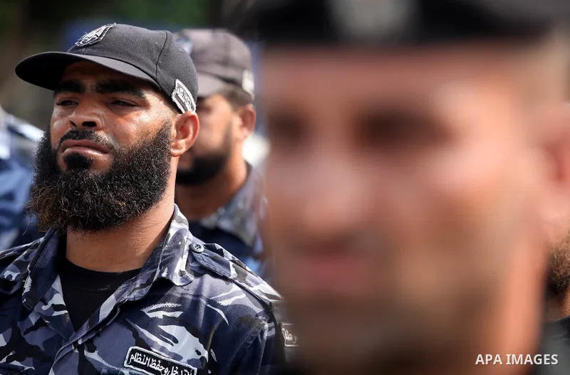 Palestinian officers participate in cleaning streets during a campaign organized by ministry of Labor, in Gaza city on July 09 2012. Photo by Majdi Fathi