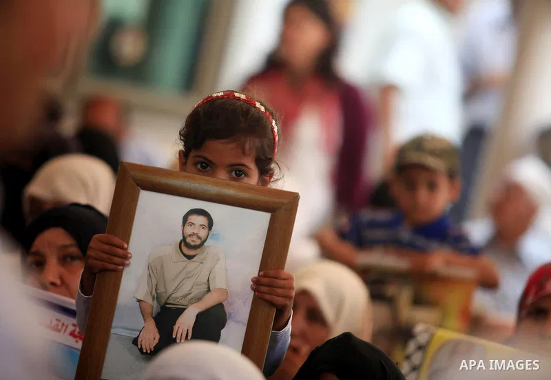 Palestinians gather during a protest in front of the Red Cross' offices in Gaza city calling of release of palestinian prisoners on July, 09, 2012. Photo by Majdi Fathi