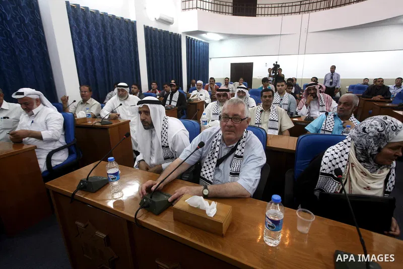 Ahmad Bahar a Hamas leader (not seen) receives members of "Miles of Smiles 14" aid convoy in Legislative Council in Gaza city on 09 July 2012. Photo by Ashraf Amra