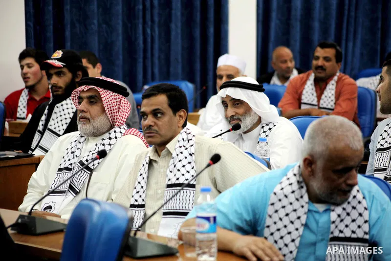 Ahmad Bahar a Hamas leader (not seen) receives members of "Miles of Smiles 14" aid convoy in Legislative Council in Gaza city on 09 July 2012. Photo by Ashraf Amra