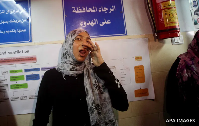 Palestinian woman reacts while Palestinian soccer player Mahmoud Al-Sarsak arrives in Gaza City July 10, 2012. Israel released the Gaza soccer player on Tuesday in a deal to end his intermittent four-month hunger strike...