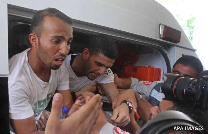 Palestinian soccer player Mahmoud Al-Sarsak greets people upon his arrival in Gaza City July 10, 2012. Israel released the Gaza soccer player on Tuesday in a deal to end his intermittent four-month hunger strike after he...