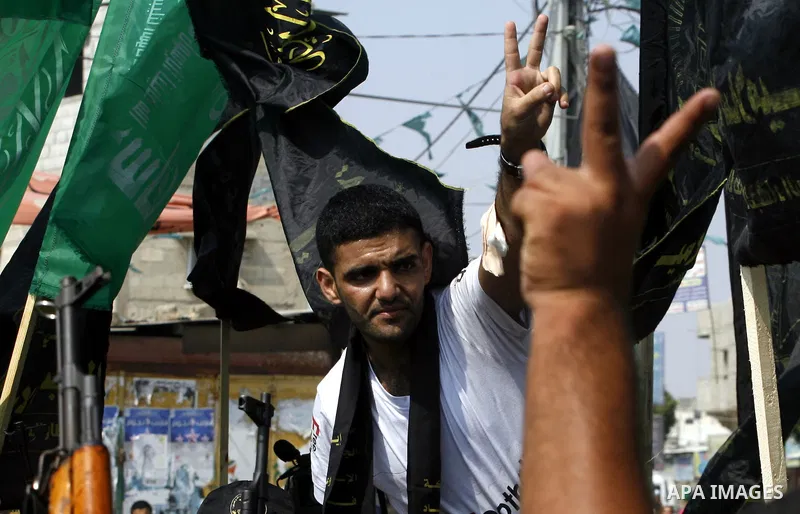 Palestinian soccer player Mahmud Sarsak who staged a hunger strike of nearly three months while in Israeli jail, flashes the V for "victory" sign as he arrives to Rafah southern Gaza strip on July 10, 2012 upon his relea...