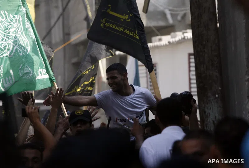 Palestinian soccer player Mahmoud Al-Sarsak greets people upon his arrival to Rafah southern Gaza strip, July 10, 2012. Israel released the Gaza soccer player on Tuesday in a deal to end his intermittent four-month hunge...