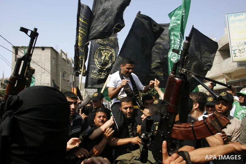 Palestinian soccer player Mahmoud Al-Sarsak greets people upon his arrival to Rafah southern Gaza strip, July 10, 2012. Israel released the Gaza soccer player on Tuesday in a deal to end his intermittent four-month hunge...