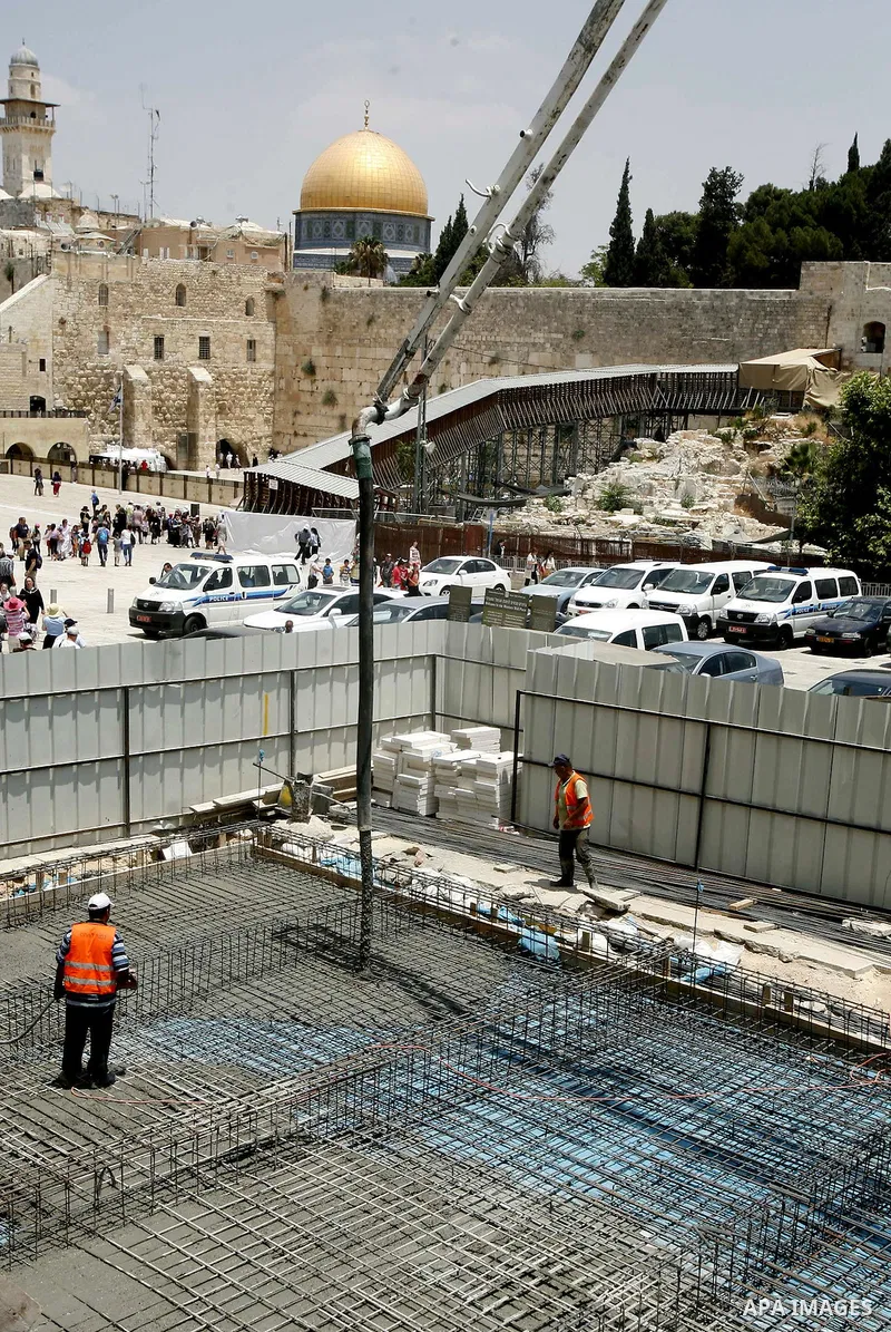 Workers of Israel are seen at an excavation site of an ancient places near al-Aqsa Mosque and Western Wall in order to judaize the area, in Jerusalem's old city, on 10 July 2012. Photo by Mahfouz Abu Turk
