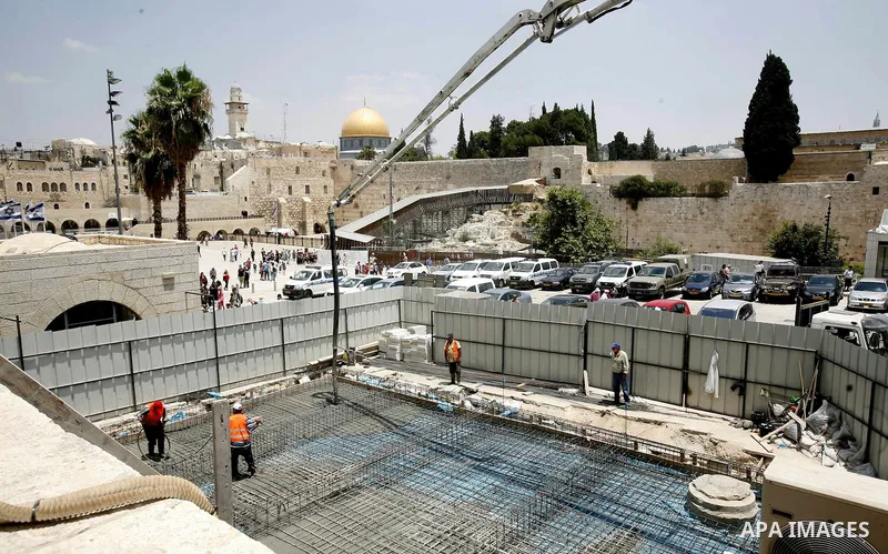 Workers of Israel are seen at an excavation site of an ancient places near al-Aqsa Mosque and Western Wall in order to judaize the area, in Jerusalem's old city, on 10 July 2012. Photo by Mahfouz Abu Turk
