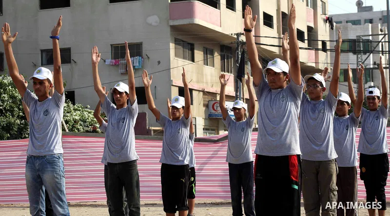 Palestinian children take part in a summer camp organized by Hamas movement at Shati refugee camp in Gaza City July 10, 2012. Hamas movement organized dozens of summer camps for Palestinian children during the period of...