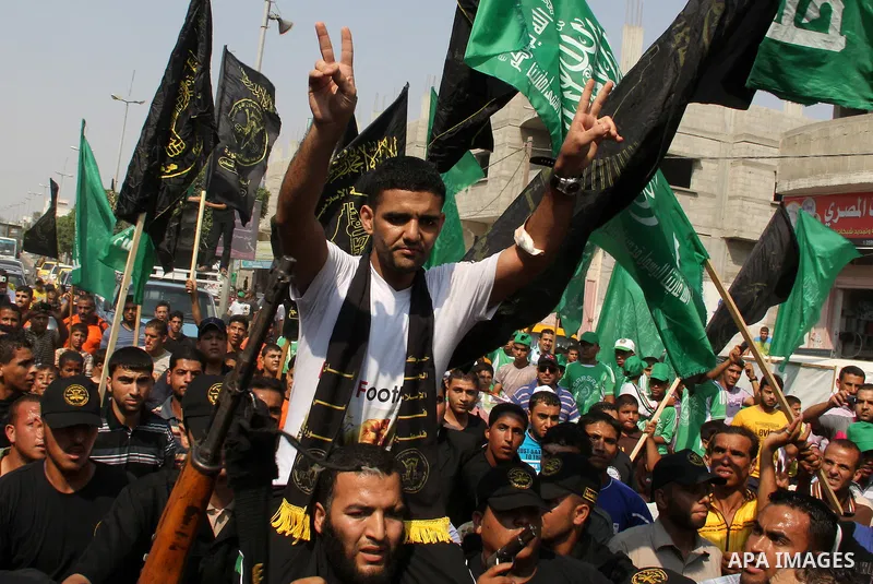 GAZA, July 10, 2012 Palestinian soccer player Mahmoud al-Sarsak flashes the victory sign upon his arrival in the southern Gaza Strip city of Rafah on July 10, 2012. Israel on Tuesday released the Palestinian prisoner who...