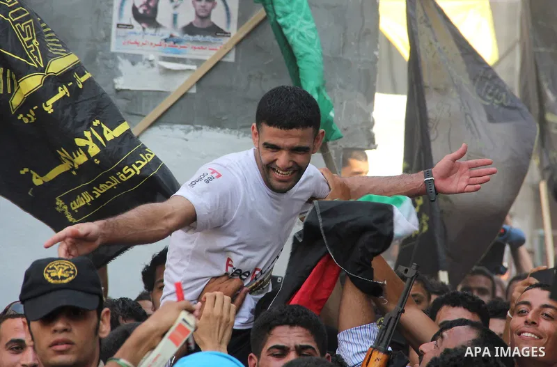 GAZA, July 10, 2012 Palestinian soccer player Mahmoud al-Sarsak is greeted by supporters upon his arrival in the southern Gaza Strip city of Rafah on July 10, 2012. Israel on Tuesday released the Palestinian prisoner who...