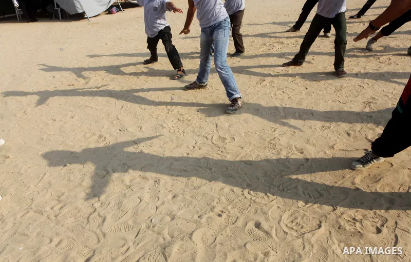 Palestinian children take part in a summer camp organized by Hamas movement at Shati refugee camp in Gaza City July 10, 2012. Hamas movement organized dozens of summer camps for Palestinian children during the period of...
