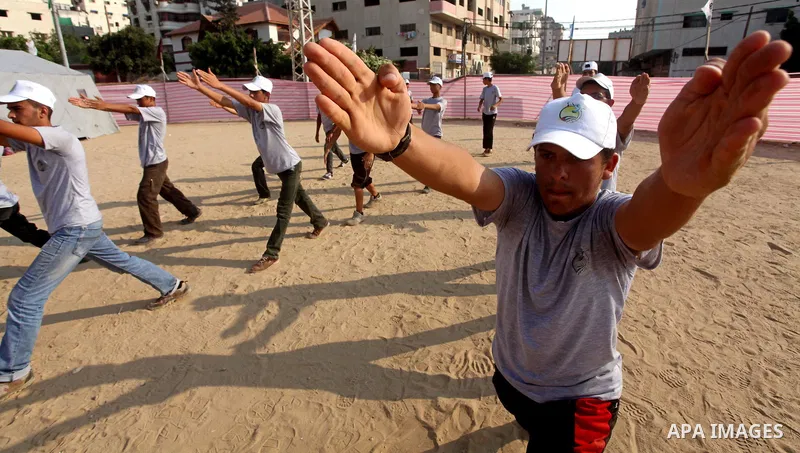 Palestinian children take part in a summer camp organized by Hamas movement at Shati refugee camp in Gaza City July 10, 2012. Hamas movement organized dozens of summer camps for Palestinian children during the period of...