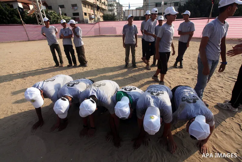 Palestinian children take part in a summer camp organized by Hamas movement at Shati refugee camp in Gaza City July 10, 2012. Hamas movement organized dozens of summer camps for Palestinian children during the period of...