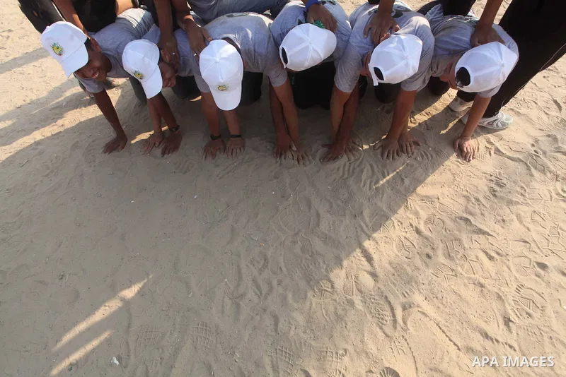 Palestinian children take part in a summer camp organized by Hamas movement at Shati refugee camp in Gaza City July 10, 2012. Hamas movement organized dozens of summer camps for Palestinian children during the period of...
