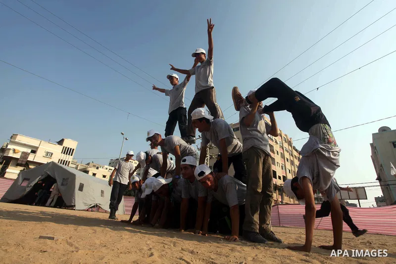 Palestinian children take part in a summer camp organized by Hamas movement at Shati refugee camp in Gaza City July 10, 2012. Hamas movement organized dozens of summer camps for Palestinian children during the period of...