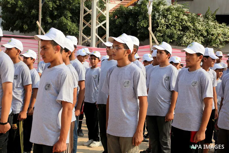 Palestinian children take part in a summer camp organized by Hamas movement at Shati refugee camp in Gaza City July 10, 2012. Hamas movement organized dozens of summer camps for Palestinian children during the period of...