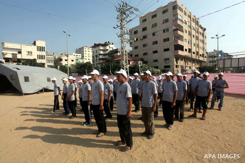 Palestinian children take part in a summer camp organized by Hamas movement at Shati refugee camp in Gaza City July 10, 2012. Hamas movement organized dozens of summer camps for Palestinian children during the period of...