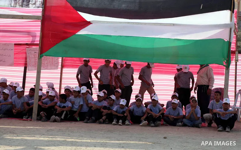 Palestinian children take part in a summer camp organized by Hamas movement at Shati refugee camp in Gaza City July 10, 2012. Hamas movement organized dozens of summer camps for Palestinian children during the period of...