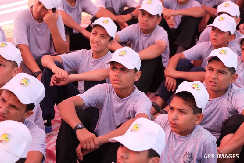 Palestinian children take part in a summer camp organized by Hamas movement at Shati refugee camp in Gaza City July 10, 2012. Hamas movement organized dozens of summer camps for Palestinian children during the period of...