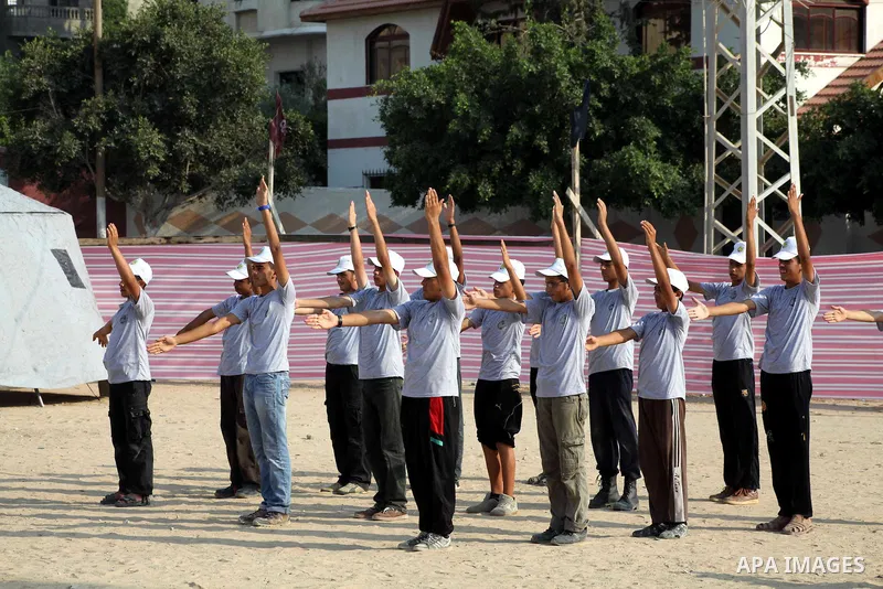 Palestinian children take part in a summer camp organized by Hamas movement at Shati refugee camp in Gaza City July 10, 2012. Hamas movement organized dozens of summer camps for Palestinian children during the period of...