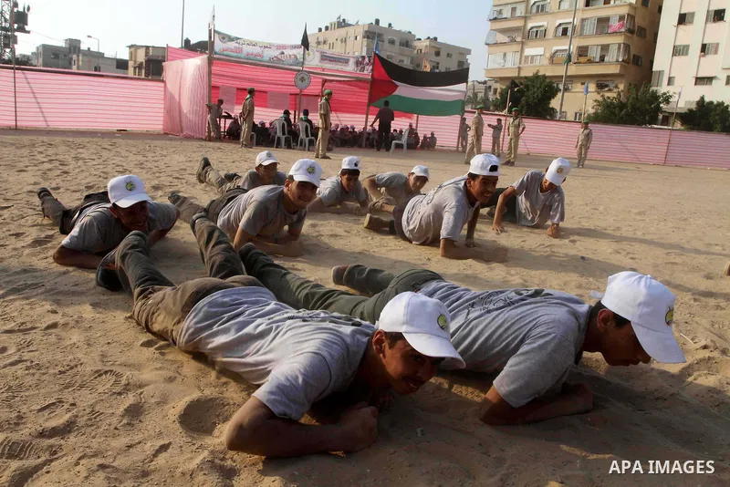 Palestinian children take part in a summer camp organized by Hamas movement at Shati refugee camp in Gaza City July 10, 2012. Hamas movement organized dozens of summer camps for Palestinian children during the period of...