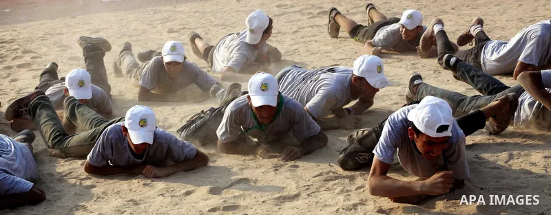 Palestinian children take part in a summer camp organized by Hamas movement at Shati refugee camp in Gaza City July 10, 2012. Hamas movement organized dozens of summer camps for Palestinian children during the period of...