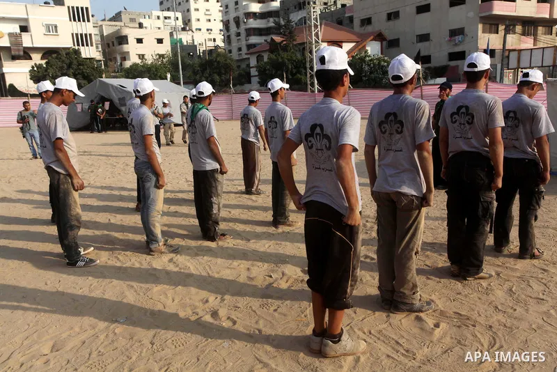 Palestinian children take part in a summer camp organized by Hamas movement at Shati refugee camp in Gaza City July 10, 2012. Hamas movement organized dozens of summer camps for Palestinian children during the period of...