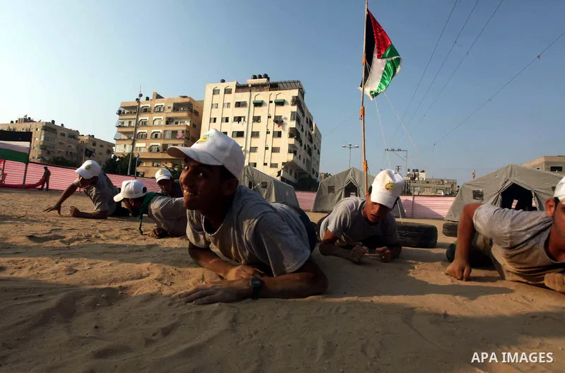 Palestinian children take part in a summer camp organized by Hamas movement at Shati refugee camp in Gaza City July 10, 2012. Hamas movement organized dozens of summer camps for Palestinian children during the period of...